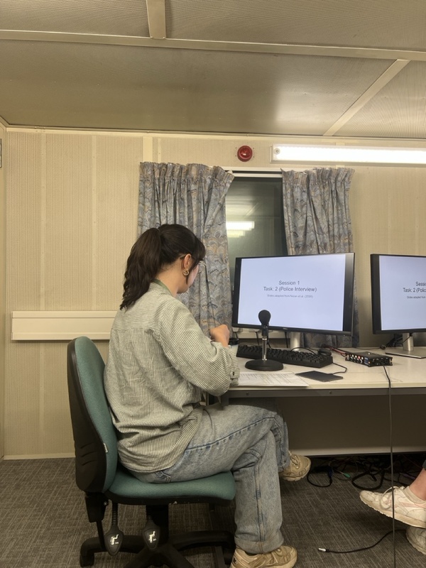 Alice Paver sitting at desk