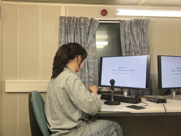 Alice Paver sitting at desk