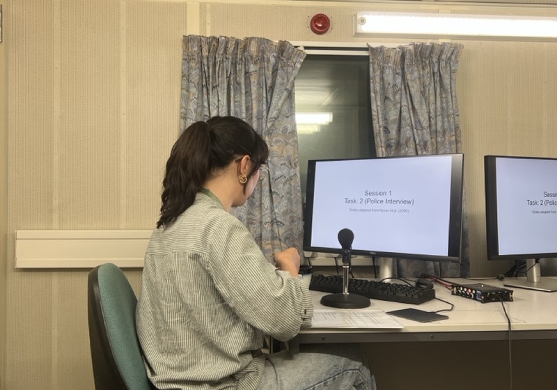 Alice Paver sitting at desk